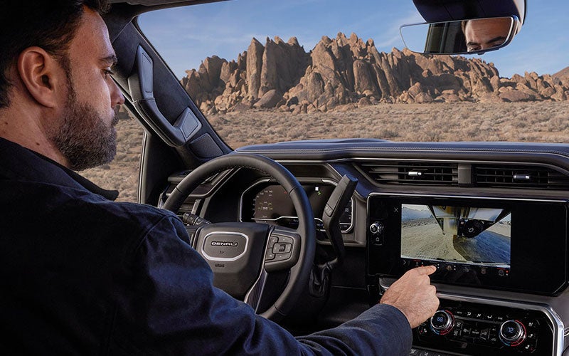 Person driving a GMC Yukon Denali